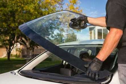 Windshield replacement technician installing auto glass in Houston at Houston Top Auto Glass