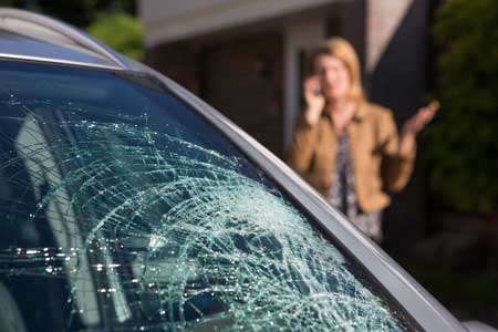 Woman call Houston Top Auto Glass for WindShield Replacement